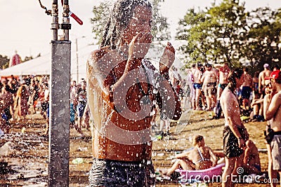 Woodstock Poland Rock festival visitor taking shower Editorial Stock Photo